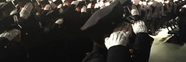 NYPD saluting during police academy graduation