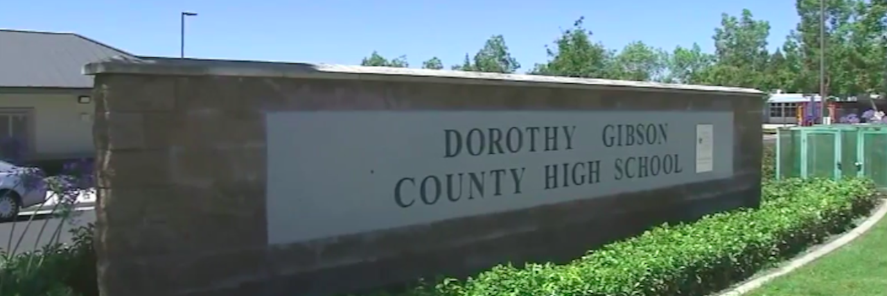 Parent Alleges Teacher's Aide Broke Elbow of Student With Disabilities Sign outside of Dorothy Gibson County High School in Ontario, California