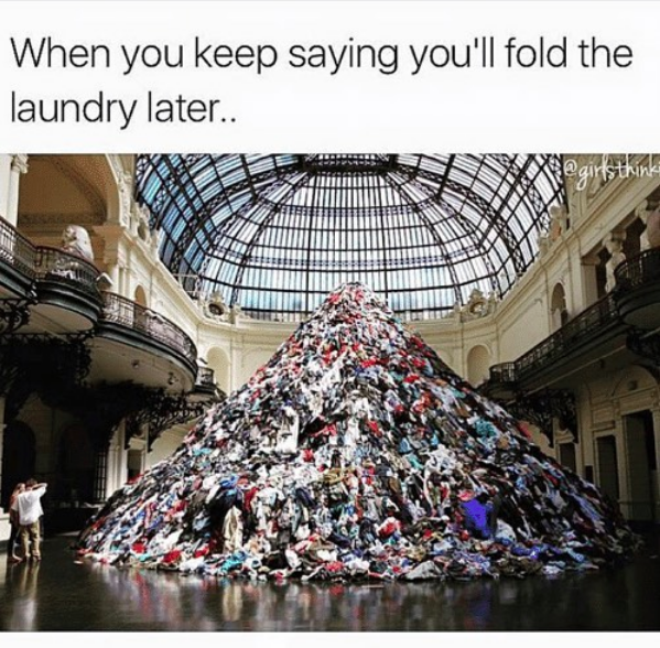 when you keep saying you'll fold the laundry later... image of giant pile of clothing inside a fancy museum