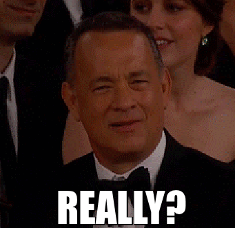 Image of Tom Hanks in a suit looking confused saying, "Really?"