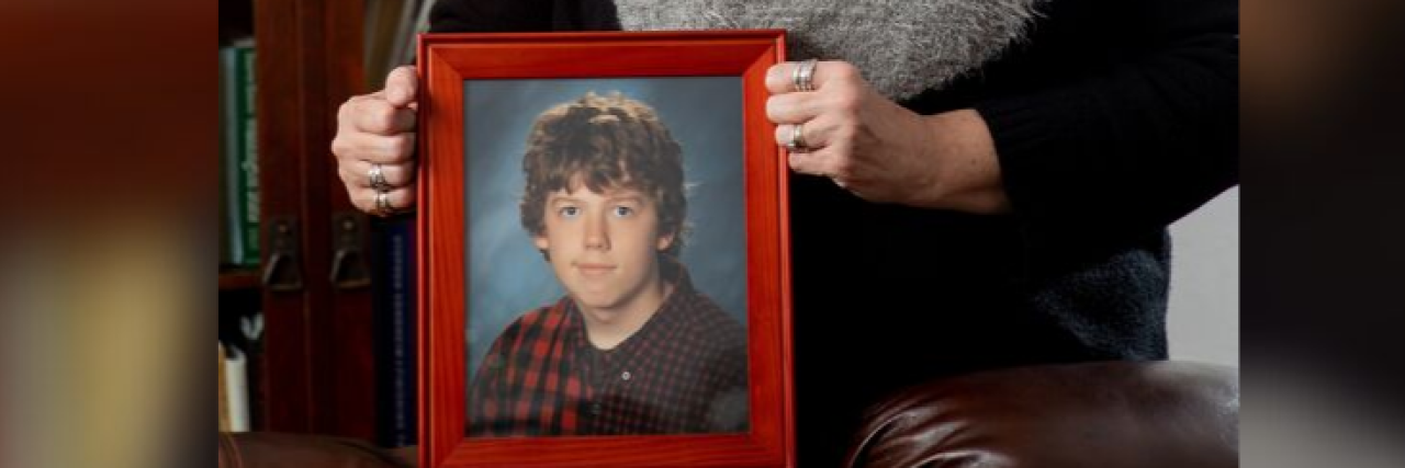 Guidelines for Talking About Mental Health and Suicide The author holding a photo of her son