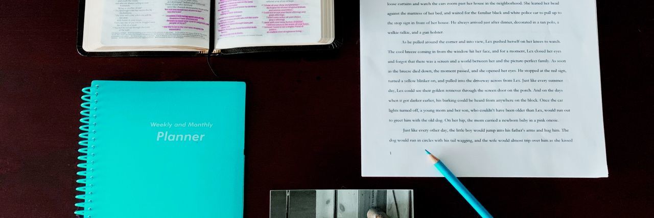 How Writing Helps Me Deal With Chronic Illness desk with an opened journal, notebook, essay and photo
