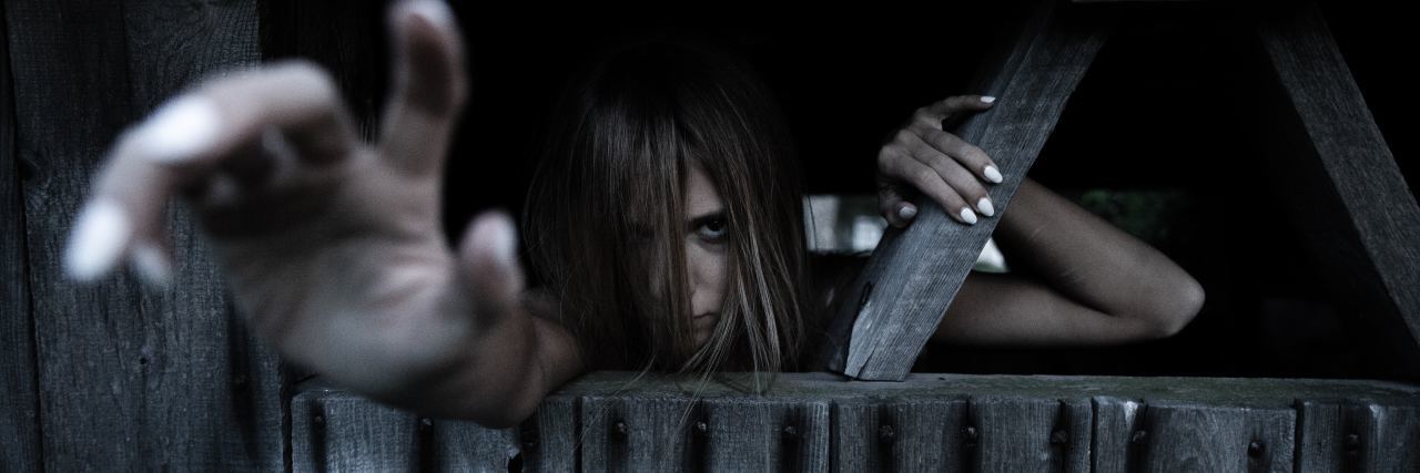 Relating to Zombies With Chronic Illness photo of woman in darkness looking like a zombie