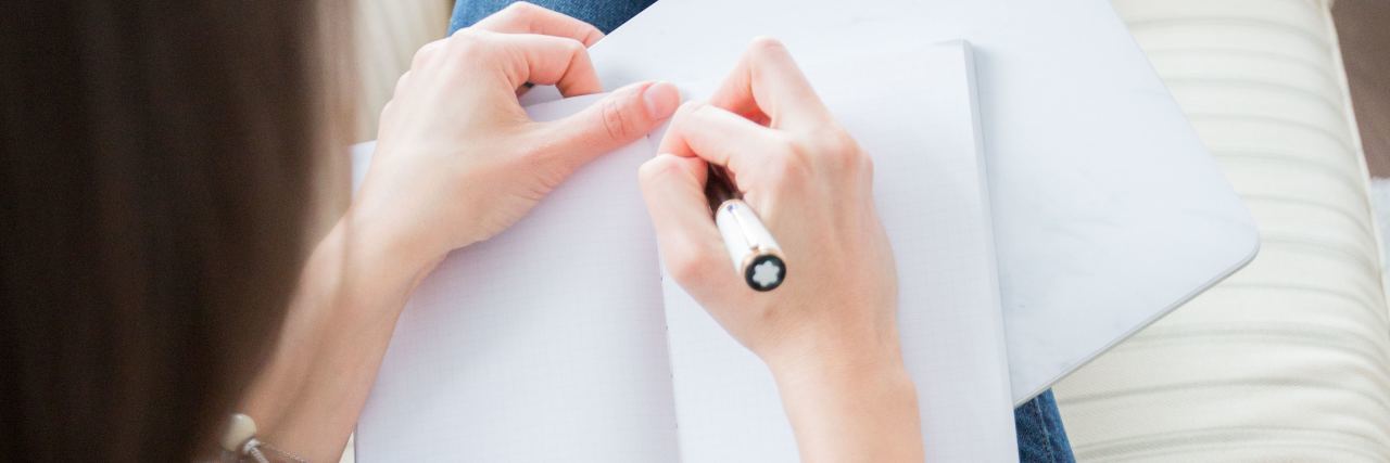 Writing as Recovery From Body Dysmorphic Disorder photo of woman writing in journal