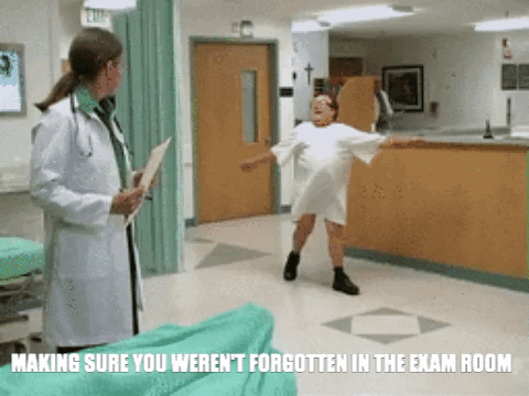 Image of man spinning around the hospital in a gown with his butt showing. The image says, "Making sure you weren't forgotten in the exam room."