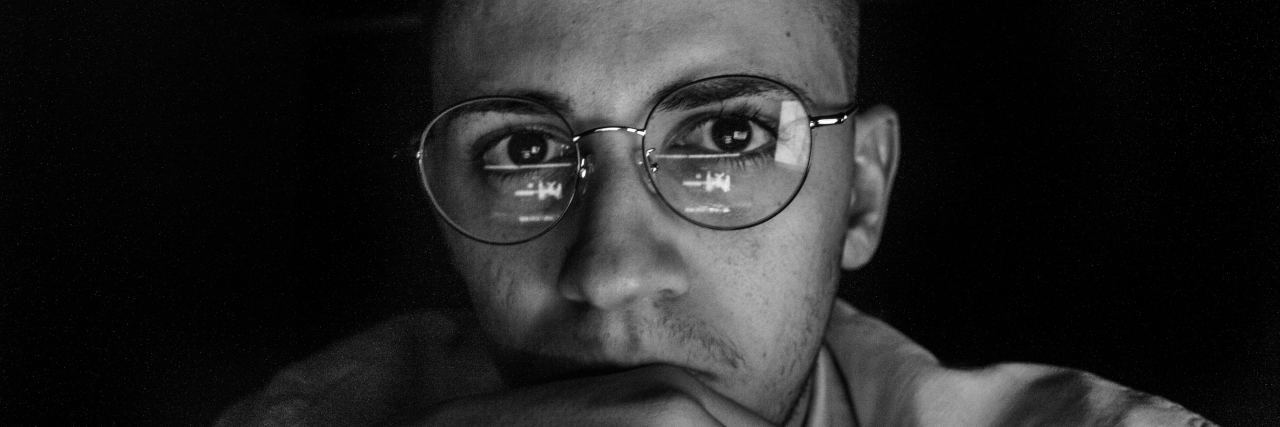 What Is Emotional Numbness? man wearing glasses