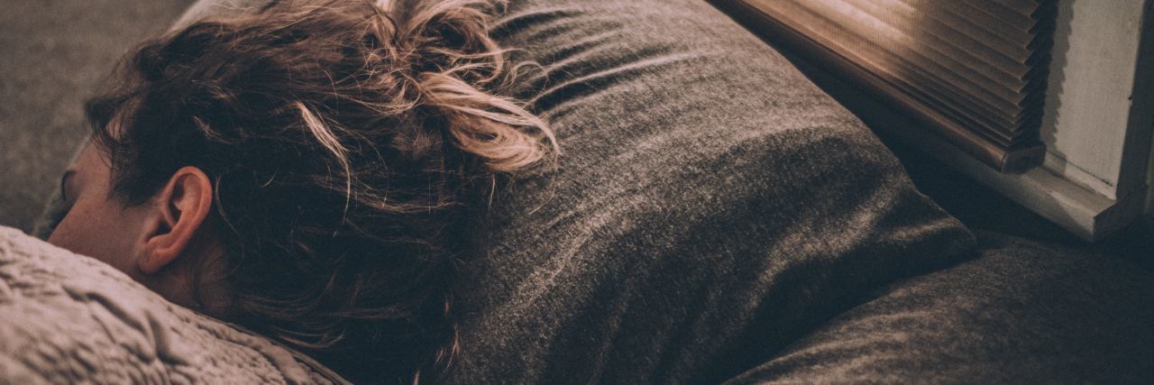 Why Depression-Induced Hypersomnia Is Not 'Lucky' woman sleeping in bed