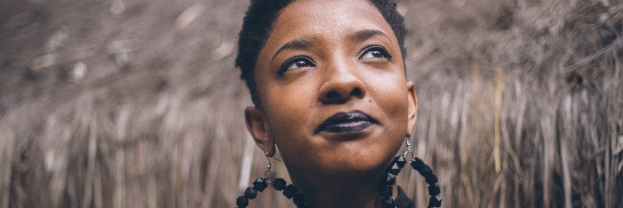 10 Things Not to Say to Someone With Endometriosis woman wearing earrings