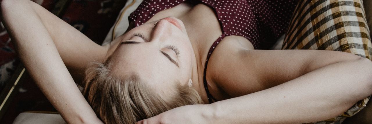 Depression Doesn't Make Me 'Pathetic' or 'Lazy' photo of blonde woman sleeping on couch