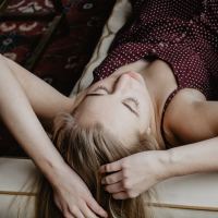 photo of blonde woman sleeping on couch