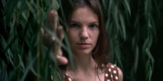 5 Common Misconceptions About Eating Disorders Debunked photo of woman standing in leaves looking into camera