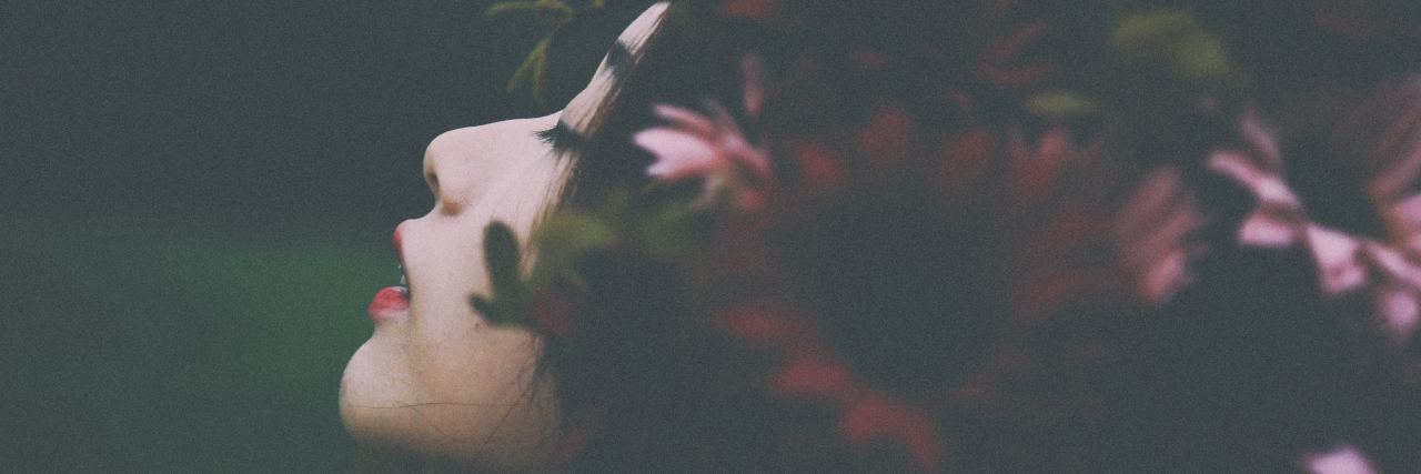 Why I'm Not Sorry to Lose Friends While Coping With PTSD woman with flowers in hair