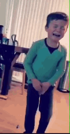 Image of a kid dancing around and crying because he has to go to the bathroom so badly.
