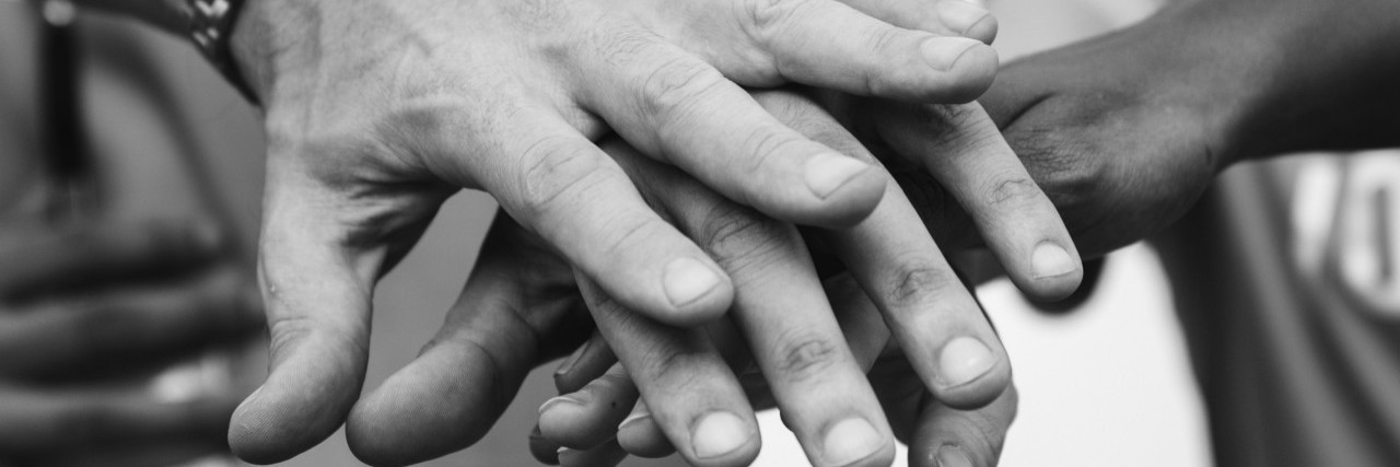 How to Talk to People With Disabilities Hands joined together in unity.