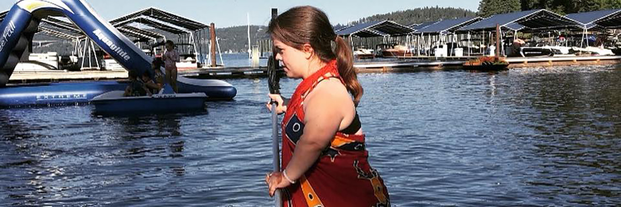 Talking to Kids About Dwarfism Sarah paddleboarding.
