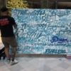 Philadelphia graffiti artist MECRO finishes a mural of words from people who live with dysautonomia.
