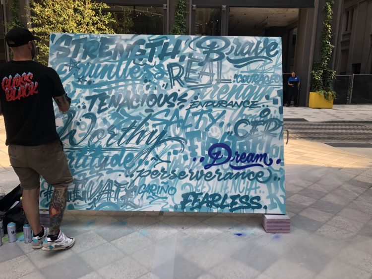 Philadelphia graffiti artist MECRO finishes a mural of words from people who live with dysautonomia.