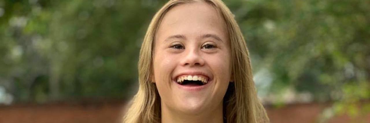 My Daughter With Down Syndrome Makes Me Proud Each Day Abigail smiling