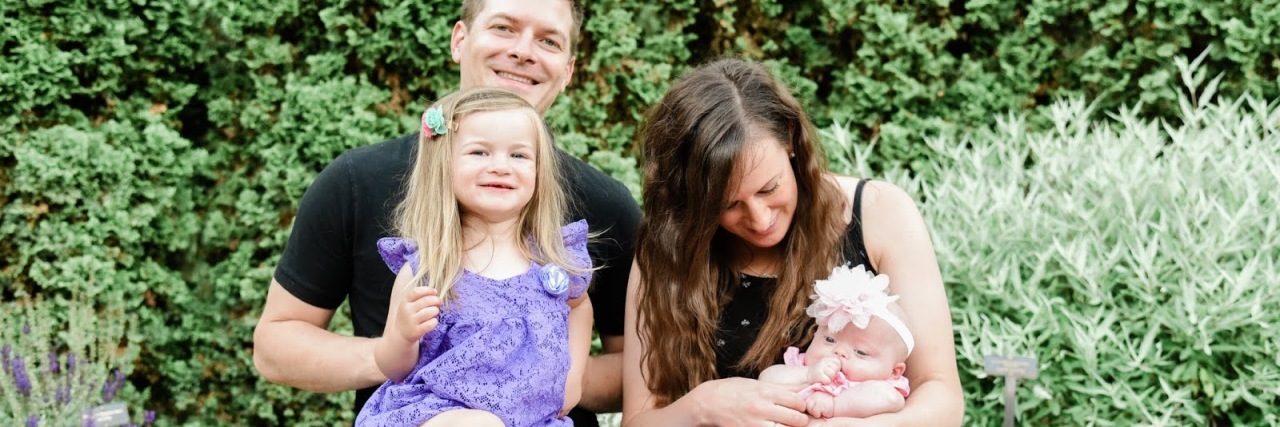 Accepting and Finding Joy in Your Child's Down Syndrome Diagnosis Baby Alice with her family.
