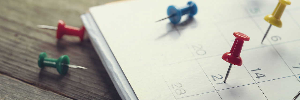 15 Tips for Anyone Who Struggles on Long Weekends thumb tacks sticking in a calendar