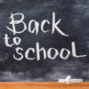 Back to school written on chalkboard.