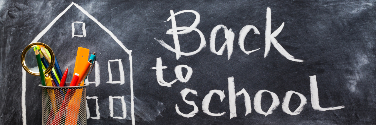 Back to school written on chalkboard.