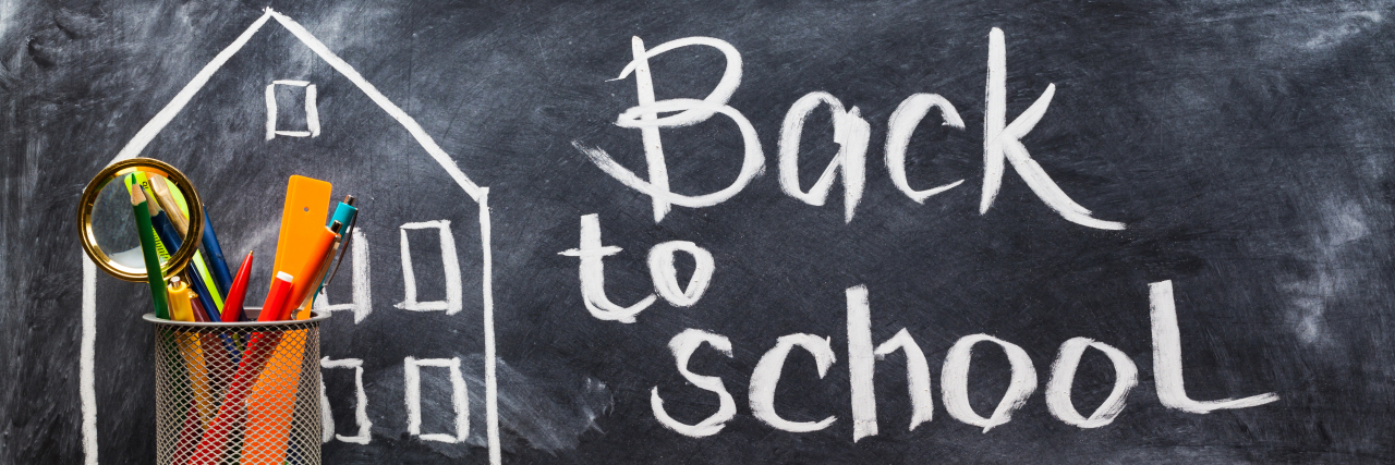 How Back to School Is Different for Families of Kids With Disabilities Back to school written on chalkboard.