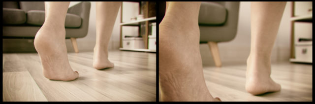 Woman's foot walking on hardwood floor.