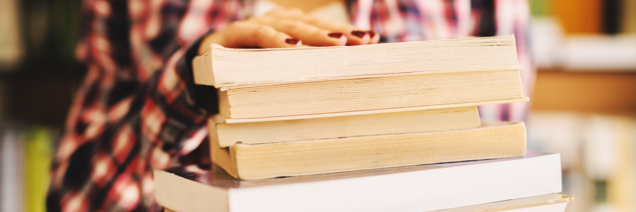 Receiving a POTS Diagnosis: What to Know Close up of hands holding books