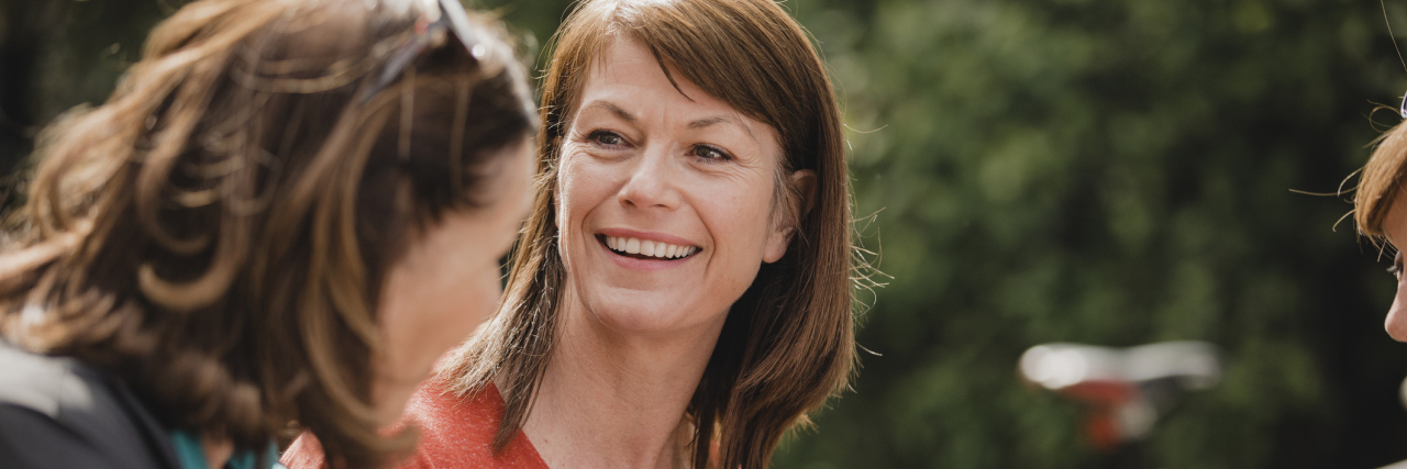 10 Things That Can Help You Cope With Your Parkinson's Diagnosis Small group of mature female cyclists sitting down in the outside seating area of a cafe. Tey are enjoying some refreshments as they take a break.