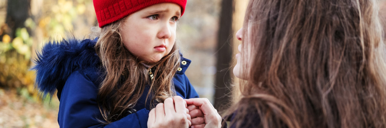 Explaining Disability to Children With Birth Injuries Sad daughter talking to her mother.