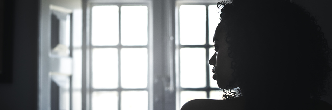 Receiving a Functional Neurological Disorder Diagnosis: What to Know silhouette of woman standing in front of window