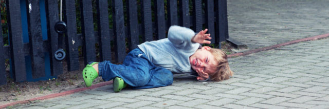 Boy on ground having a meltdown