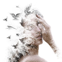 Double Exposure portrait of a woman with birds.