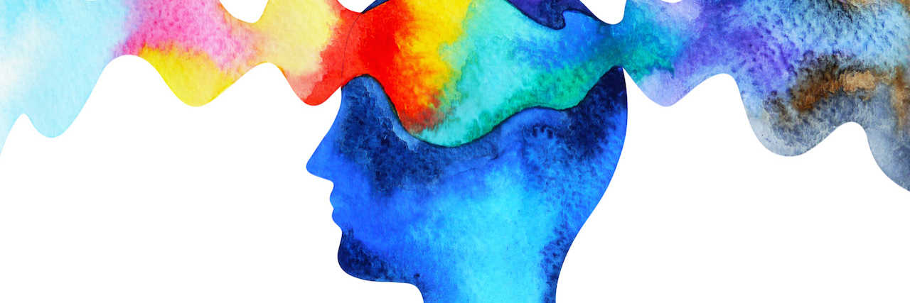 How to Talk About Dissociative Identity Disorder Watercolor paining of a head, with a scream of rainbow colors flowing through it