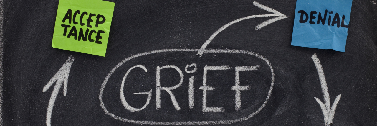 Experiencing the Five Stages of Grief With Chronic Illness the 5 stages of grief (denial, anger, bargaining, depression, acceptance) written on a chalkboard