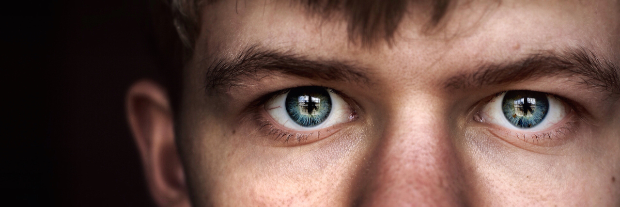 A Letter to ER Staff, About My Son With Juvenile Bipolar Disorder Close up of a young man with piercing blue eyes