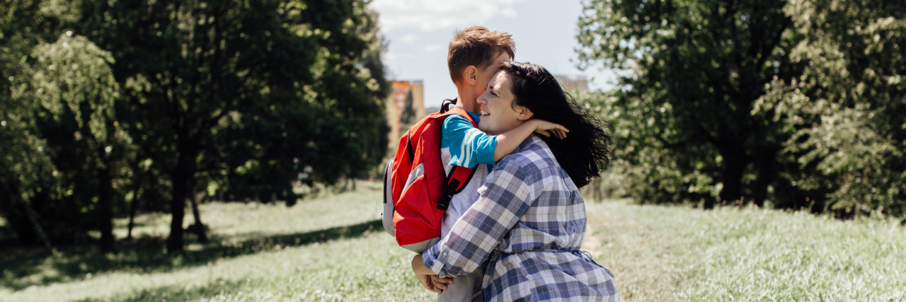 Being Called 'Strong' as a Mom With Chronic Illness Mother hugging her son on the way to school