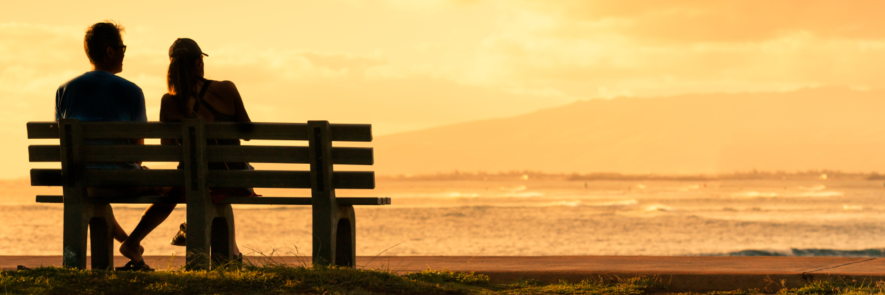 Having a Friend or Family Member With ALS: What It Feels Like Man and woman sitting on bench near a bike