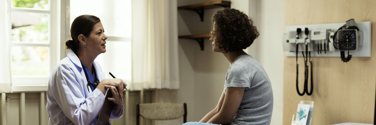 How to Partner With Your Doctor and Take Charge of Your Healing a patient and a doctor talking to each other in an exam room