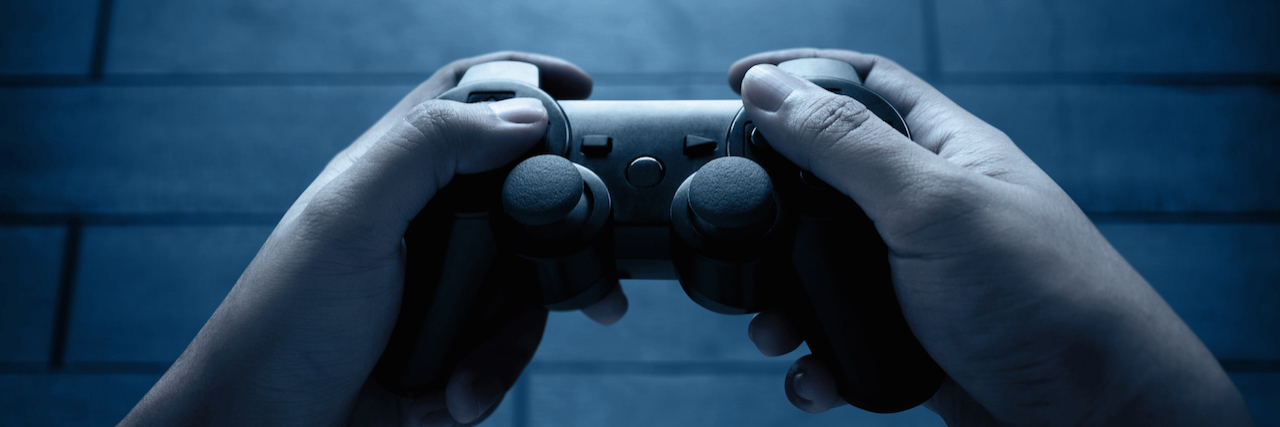 Don't Blame Video Games or Mental Health for Violent Acts A game controller playing video games