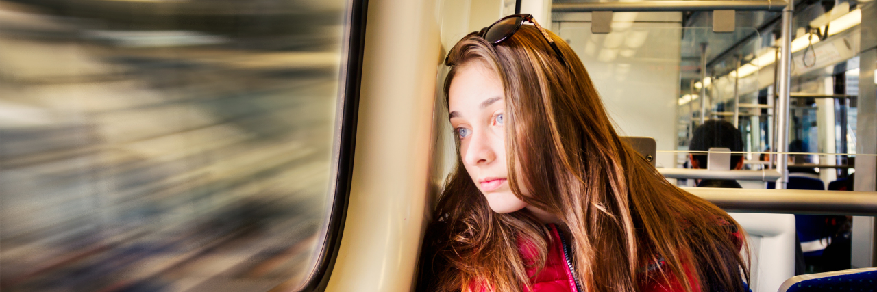 Developing Coping Skills for Invisible Chronic Illness young girl looking out the window on a bus