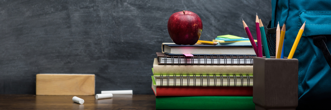 Starting a New School Year as a Teacher With Cerebral Palsy Back to school supplies on desk.