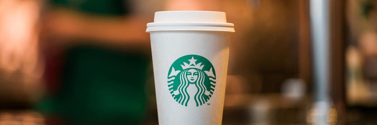 Man With Crohn's Says He Was Denied Boston Starbucks Bathroom Use Starbucks cup on counter