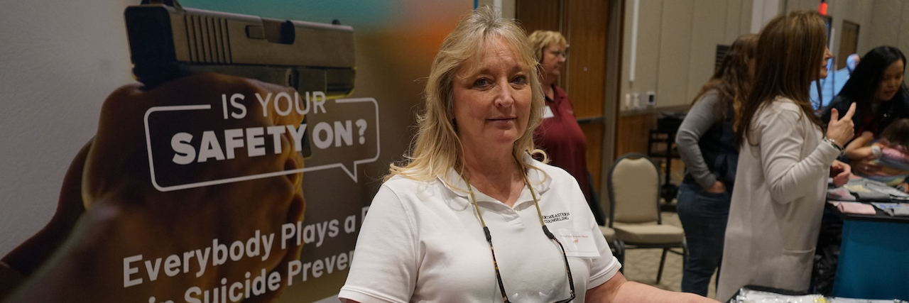 KHN: Why Suicide Prevention Advocates Target Gun Shows Northeastern Counseling Center prevention specialist Robin Hatch gave out gun socks screen-printed with the National Suicide Prevention Lifeline information at the Vernal Gun & Knife Show in Vernal, Utah. (Erik Neumann/KUER)