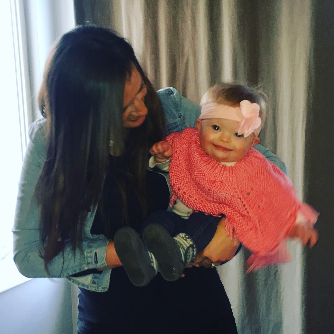 Ann with her toddler daughter who has Down syndrome