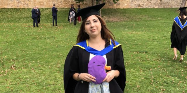 6 'Spoonie' Tips to Remember If You're Worried About Attending College  the author standing proudly in her cap and gown at graduation