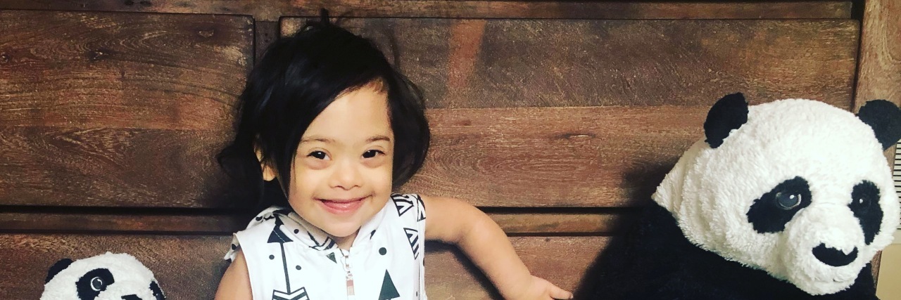 Doctors Need to Change the Way They Deliver a Down Syndrome Diagnosis Boy with Down syndrome smiling at camera