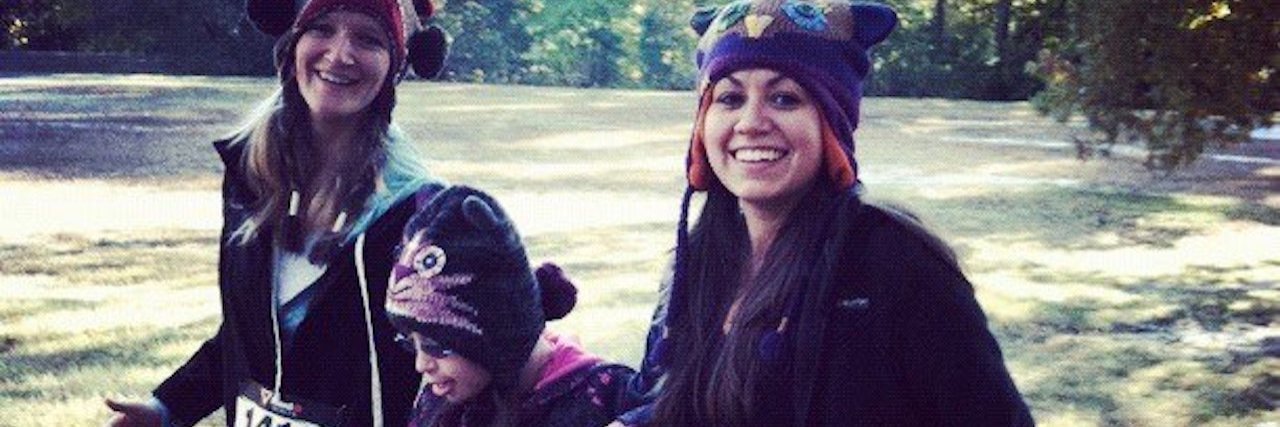 The Teachers Who Transformed My Daughter With Down Syndrome Yassy running between her teachers