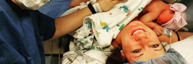 new parents cradling baby after c-section